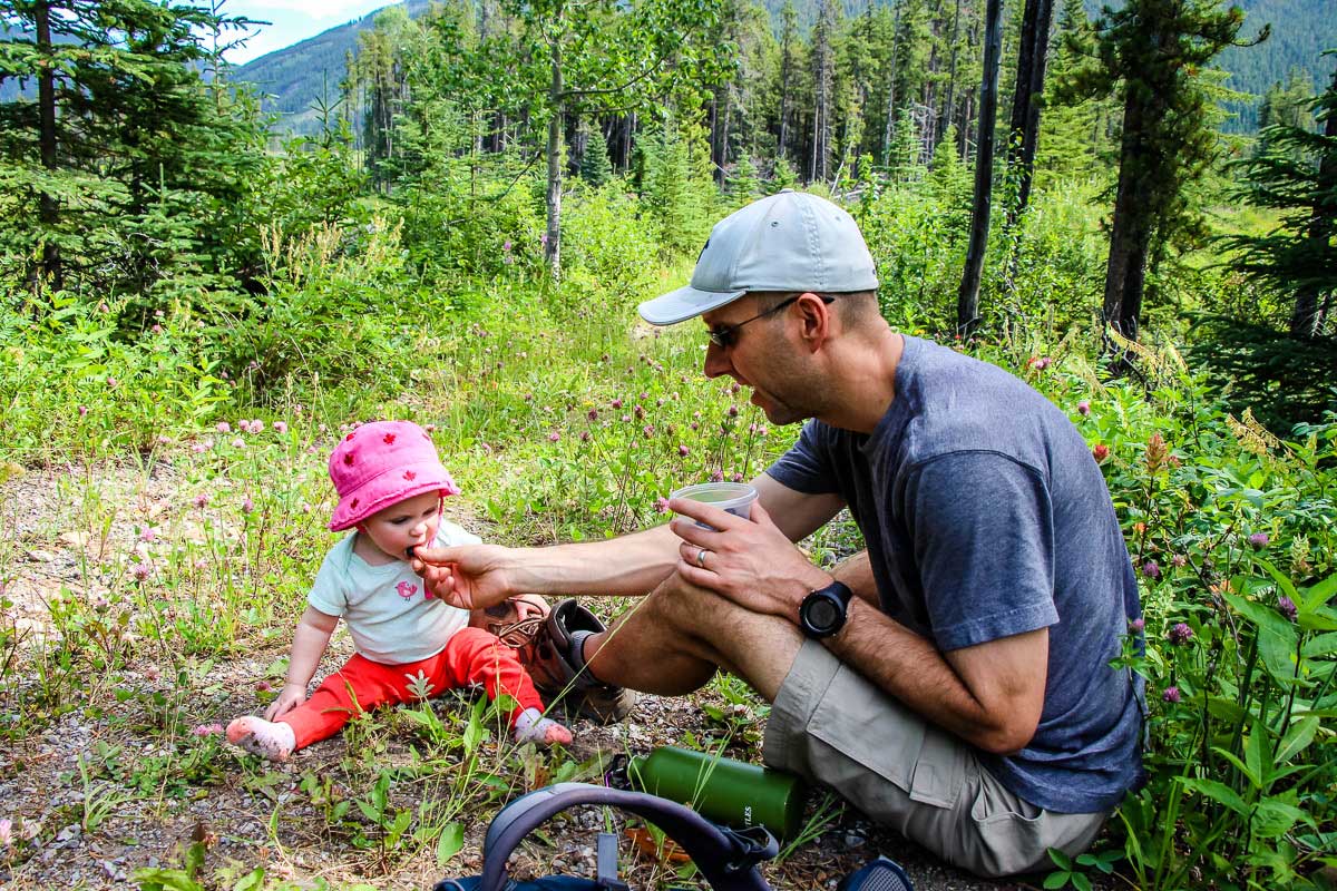 feeding baby while hiking