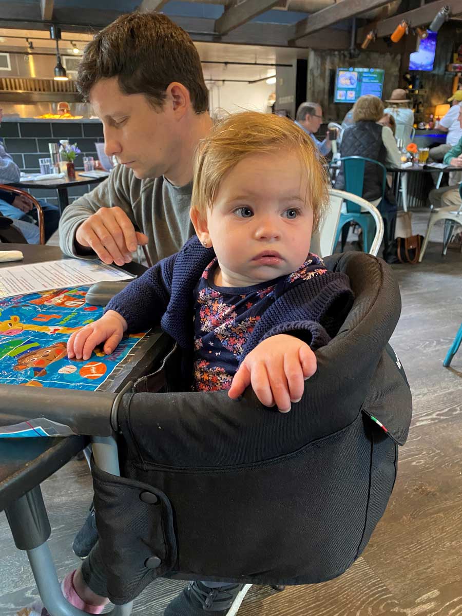 Baby sitting in Ingelsina high chair - attachable high chair to table