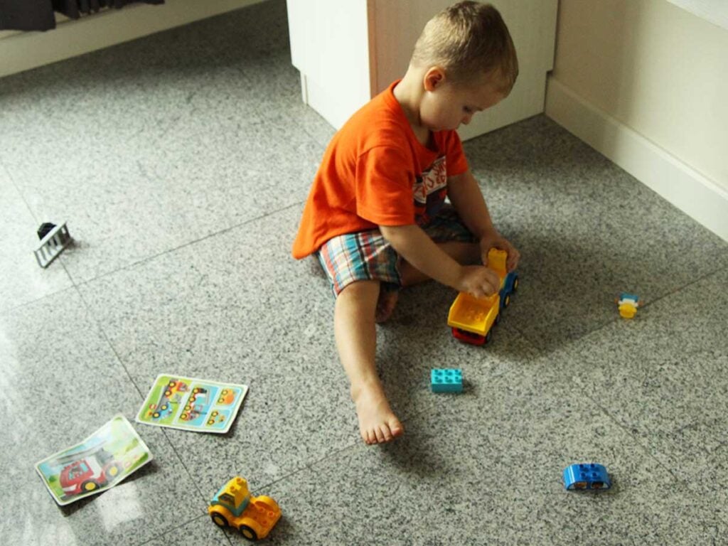 3 year old playing with Lego Duplo on Thailand trip.