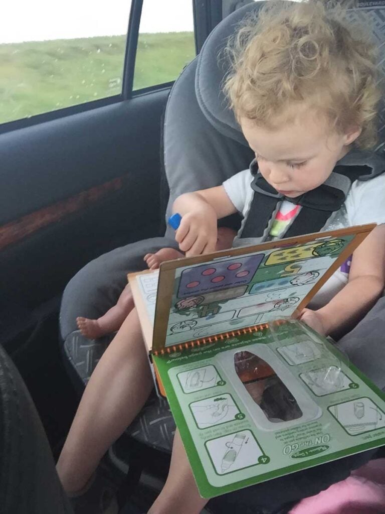 2 year old toddler using Melissa & Doug Water Wow in the Car.