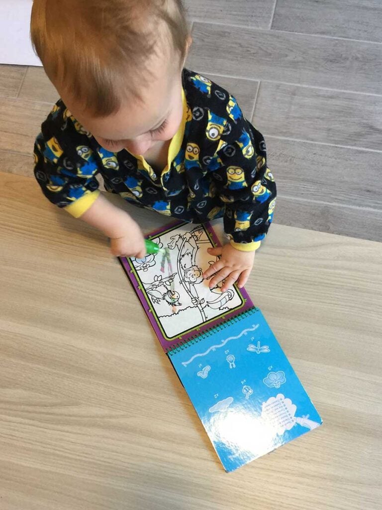 1 year old toddler coloring on Melissa & Doug Water Wow
